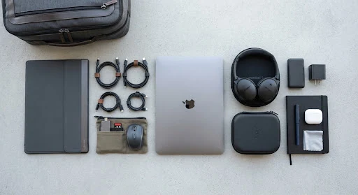 A neatly arranged travel technology kit.